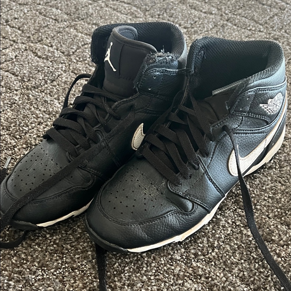 Nike Black Mid-Top Cleats with White Swoosh